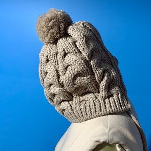 Hat so me satin lined Pom Pom winter hat.